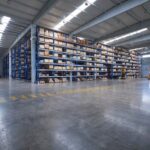 A spacious warehouse with numerous shelves showcasing floor coatings in St. Clair, MI