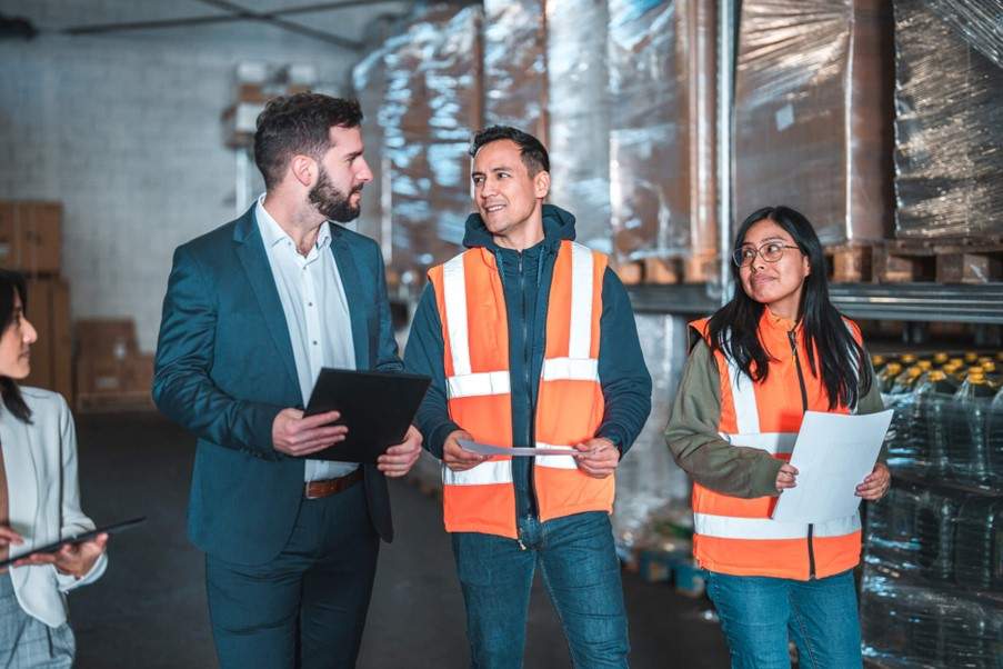A team of workers walking through a factory in St. Clair, MI