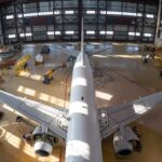 Airplane parked in a hangar showcasing flooring solutions for aviation facilities in St. Clair, MI