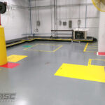 Epoxy flooring with safety markings in utility room serving Michigan, Ohio and Indiana