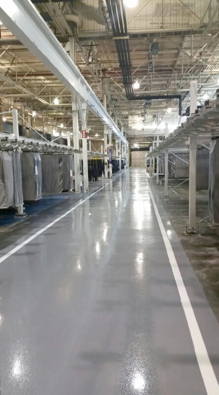 A Large Empty Warehouse with Yellow Safety Lines in Michigan, Ohio & Indiana