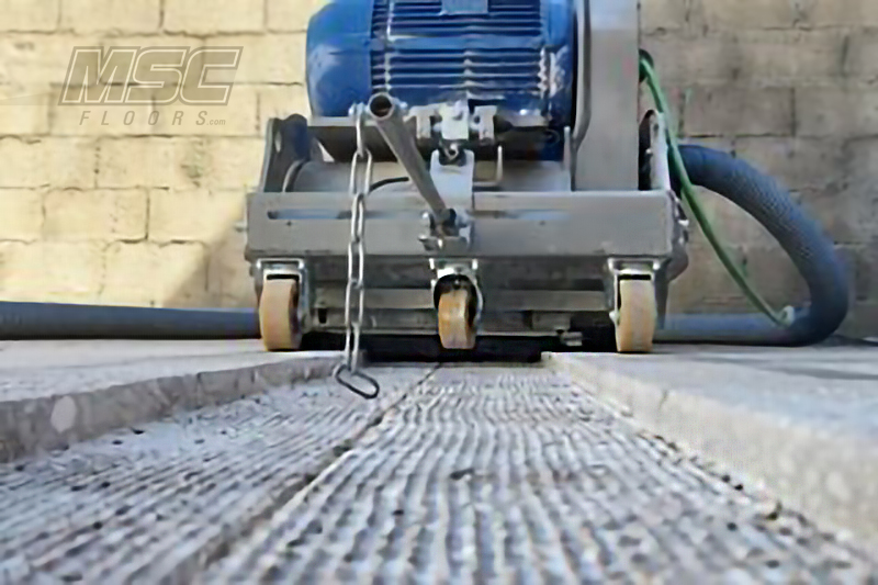 Worker Uses Levelling Machine on New Green Flooring in Michigan, Ohio & Indiana